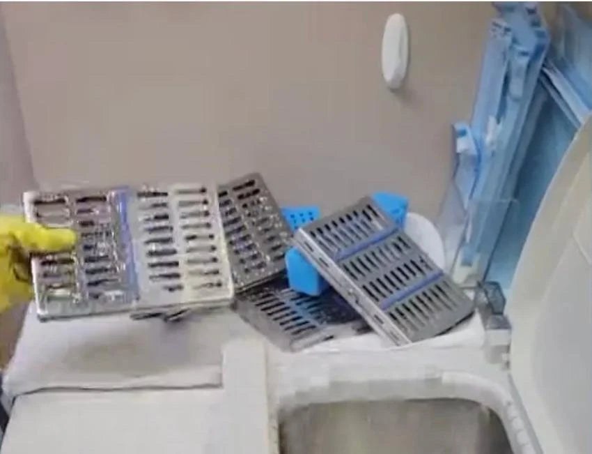 Wet instrument cassettes stacked on a towel